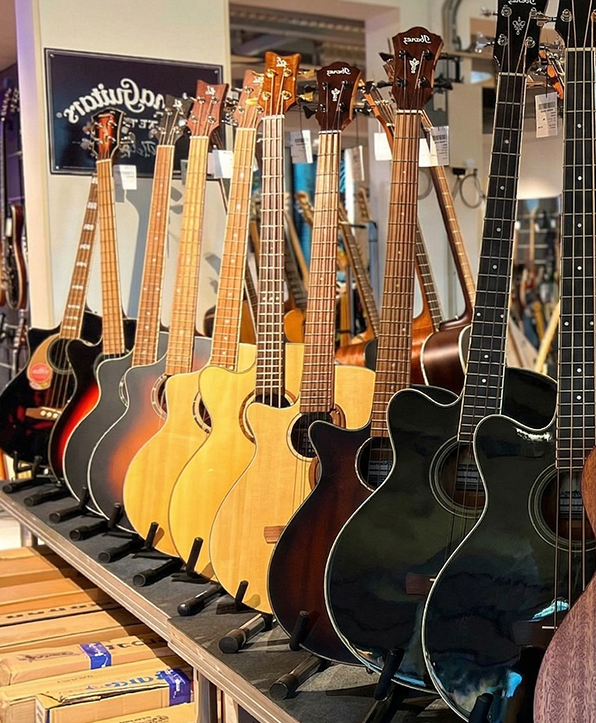Acoustic guitars displayed in pawnshop